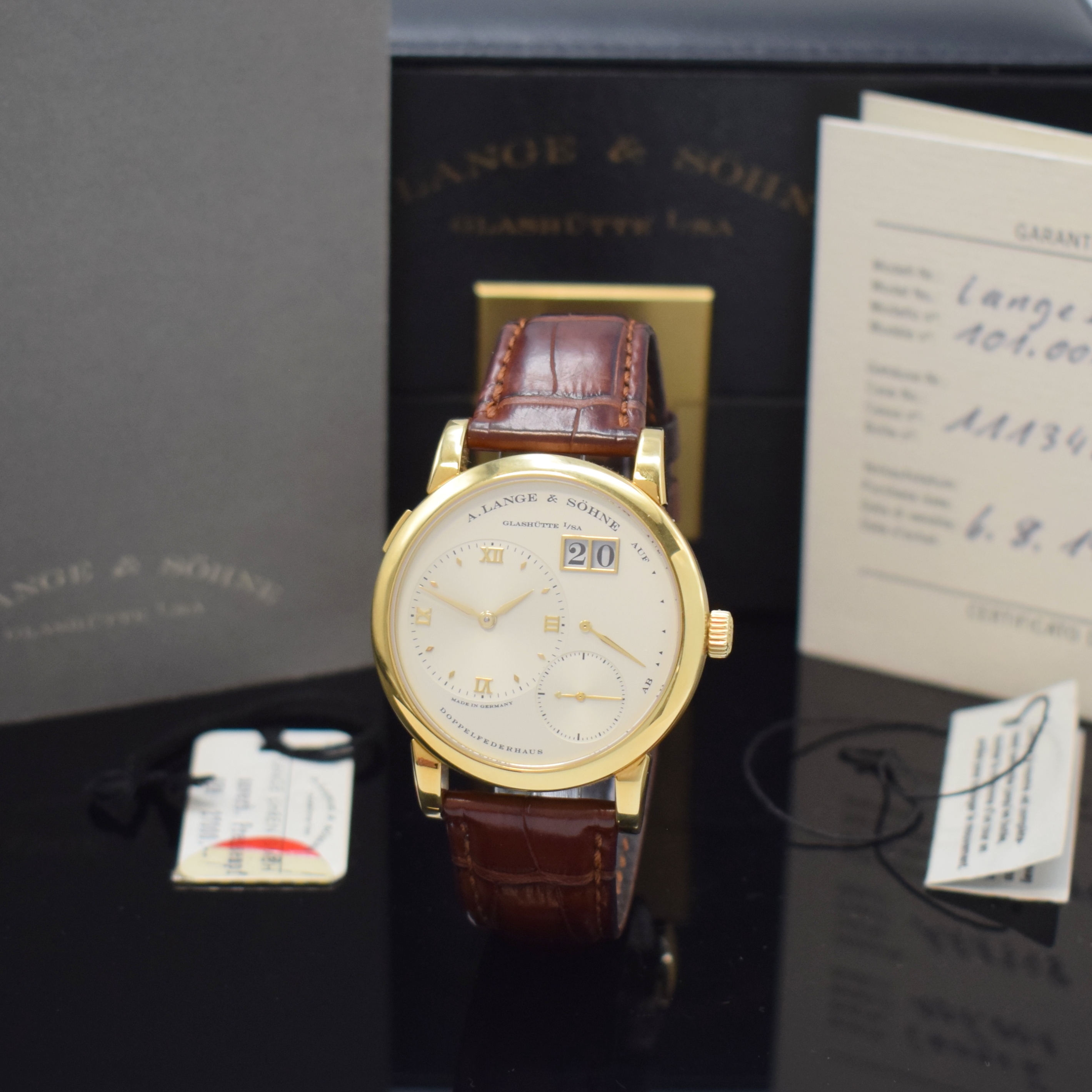 A. LANGE & SÖHNE sehr seltene frühe Lange 1 Referenz 101.001 in GG 750/000, Handaufzug, noch massiver Goldboden 6-fach verschr., innen bez. R.101, ...