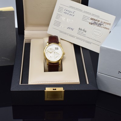 26783108g - A. LANGE & SÖHNE very rare & early Lange 1 reference 101.001 in 18k yellow gold, manual winding, solid gold back 6-times screwed, silvered dial, applied gilded indices, separate dials for hours/minutes, second, power reserve indicator and big date, gilded alpha hands, nickel silver movement calibre 901.0, Glashutter stripe, 53 jewels, 9 screwed down gold chatons, Glucydur-balance with Breguet-hairspring, in 5 Lagen reguliert, original leather strap with original 18k yellow gold buckle, diameter approx. 38,5 mm, original box, Hangtag and papers enclosed, condition 2