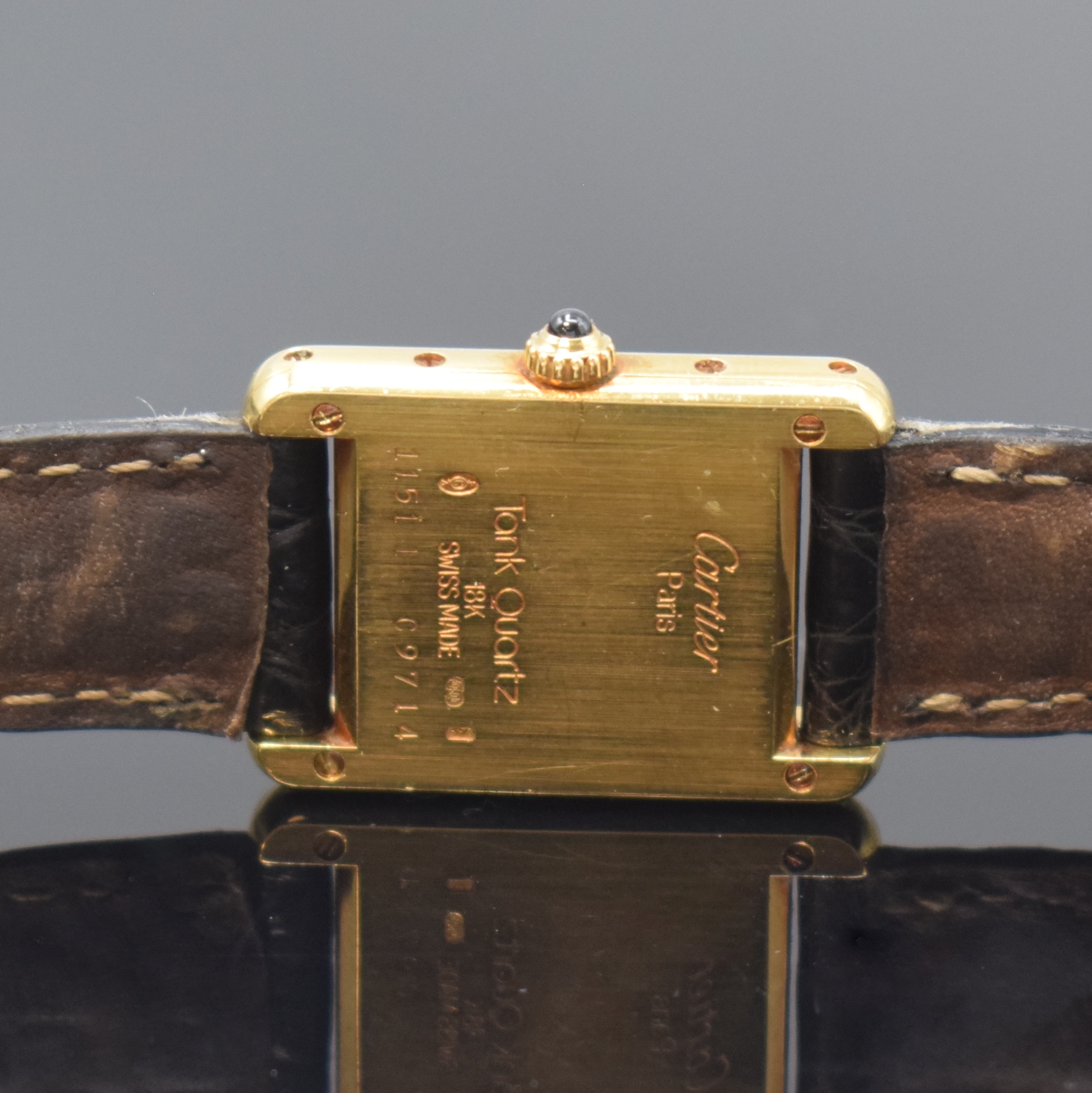 Detail c: CARTIER Paris Tank Armbanduhr in GG 750/000, Schweiz um 1990, quarz, Gehäuse seitl. 4-fach verschr., orig. Lederband m. verg. Faltschl., ...
