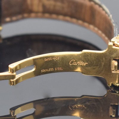 26783440b - CARTIER Paris 18k yellow gold Tank wristwatch, Switzerland around 1990, quartz, case at the sides 4-times screwed down, original leather strap with gold-plated deployant clasp, jeweled crown, white dial with Roman numerals, blued steel hands, measures approx. 28 x 21 mm, condition 2-3