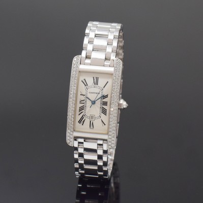 Image 26783870 - CARTIER 18k white gold and factory diamonds set wristwatch Tank Americaine reference 1726, self winding, Switzerland around 1995, original bracelet with butterfly buckle, back with 8 screws, silvered, engine-turned dial with Roman hours, blued steel hands, display of hours, minutes, sweep seconds and date, Diamantkrone, rhodium plated movement, 25 jewels, calibre 077 with fausses cotes decoration, measures approx. 42 x 23 mm, length approx. 19,5 cm, weight approx. 129g, condition 2-3