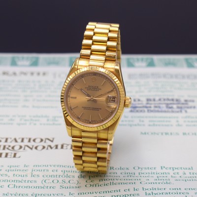 Image 26783877 - ROLEX 18k yellow gold medium wristwatch Oyster Perpetual Datejust reference 68278, self winding, E-series, superlative chronometer officially certified, president bracelet with deployant clasp, fluted bezel, screwed down winding crown and case back with owners engraving UB, champagne coloured dial with raised indices, display of hours, minutes, sweep seconds and date under sapphire loupe glass, diameter approx. 31 mm, length approx. 18,5 cm, original certificate, sold in October 1991, signs of use due to age, condition 2-3