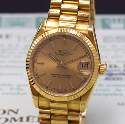 Image 26783877a - ROLEX 18k yellow gold medium wristwatch Oyster Perpetual Datejust reference 68278, self winding, E-series, superlative chronometer officially certified, president bracelet with deployant clasp, fluted bezel, screwed down winding crown and case back with owners engraving UB, champagne coloured dial with raised indices, display of hours, minutes, sweep seconds and date under sapphire loupe glass, diameter approx. 31 mm, length approx. 18,5 cm, original certificate, sold in October 1991, signs of use due to age, condition 2-3