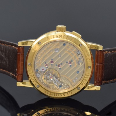 26784406f - A. LANGE & SÖHNE 18k yellow gold wristwatch Saxonia reference 105.021, manual winding, Germany around 2000, on both sides glazed case including original leather strap with original 18k yellow gold buckle, case back 6- times screwed, correction for date at 2, silvered dial, big date at 12, constant second at 6, blued steel hands, nickel silver movement calibre 941.3 with fausses cotes decoration, 30 jewels, 4 screwed down gold chatons, 5 adjustments, precision adjustment, diameter approx. 34 mm, condition 2