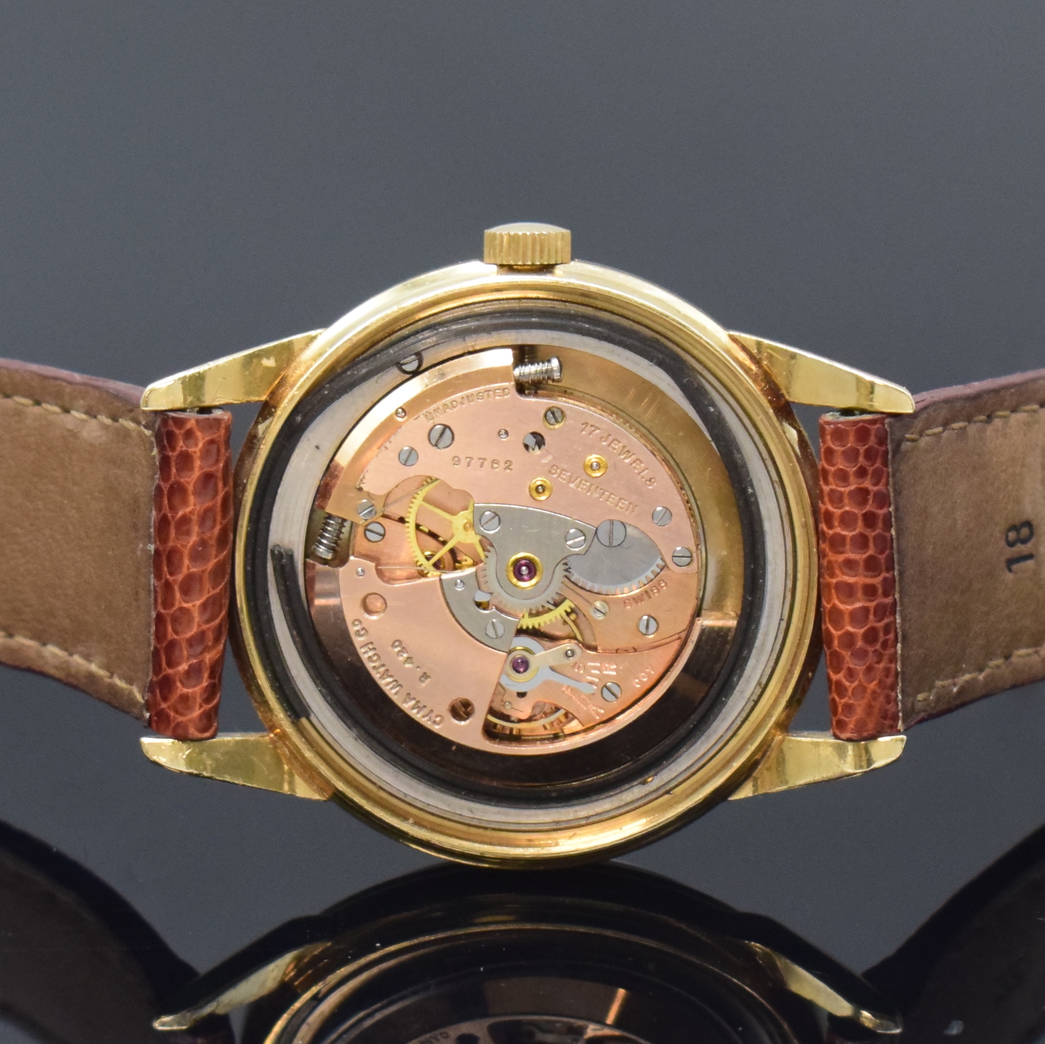 Detail d: CYMA Herrenarmbanduhr in GG 585/000, Schweiz / USA um 1950, Hammerautomatik, verschr. USA-Geh., Boden sign., silb. orig. Zifferbl. pat., gold. ...