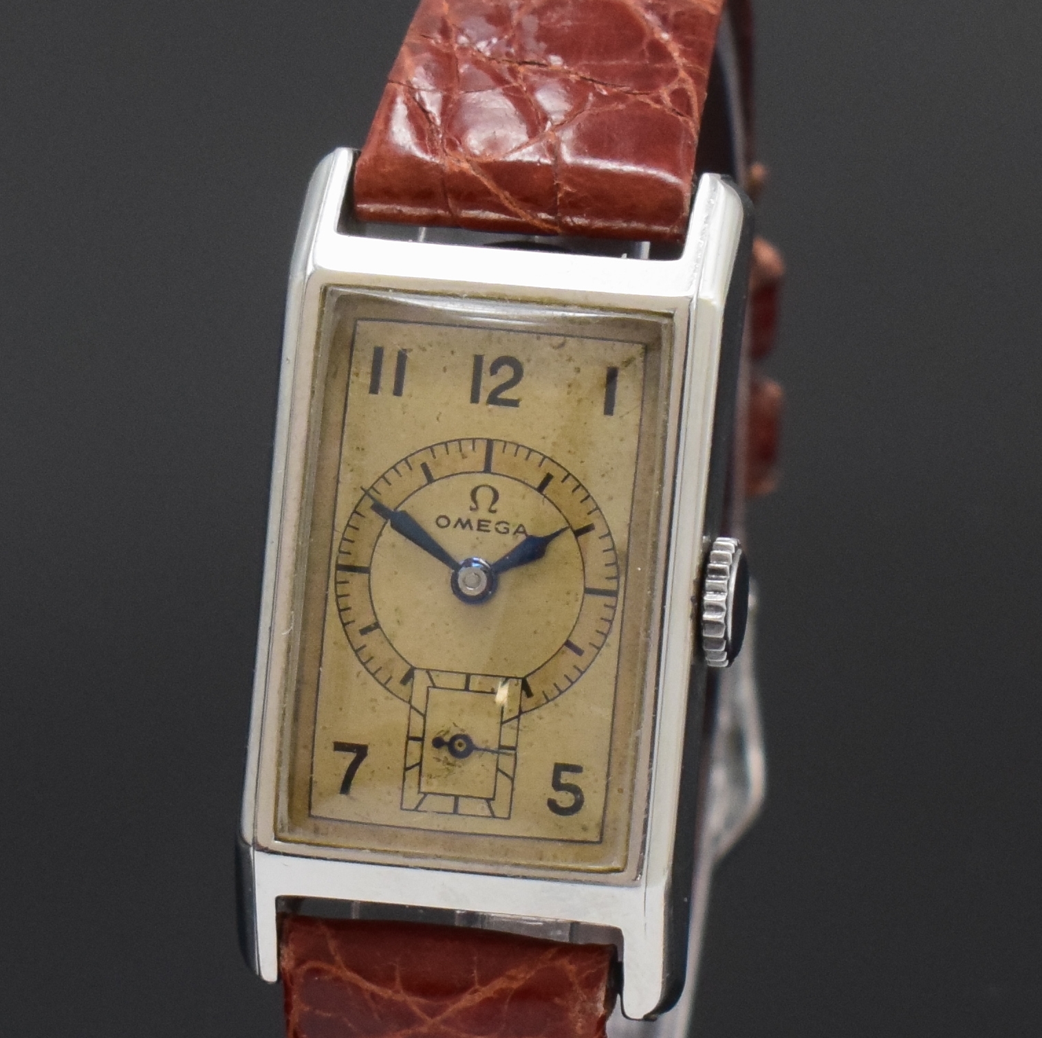 Detail a: OMEGA T17 rechteckige Armbanduhr in Stahl, Schweiz um 1936, Handaufzug, 2-tlg. Geh., Boden aufgedr., orig. Zifferbl. pat. m. emailliertem Druck, ...