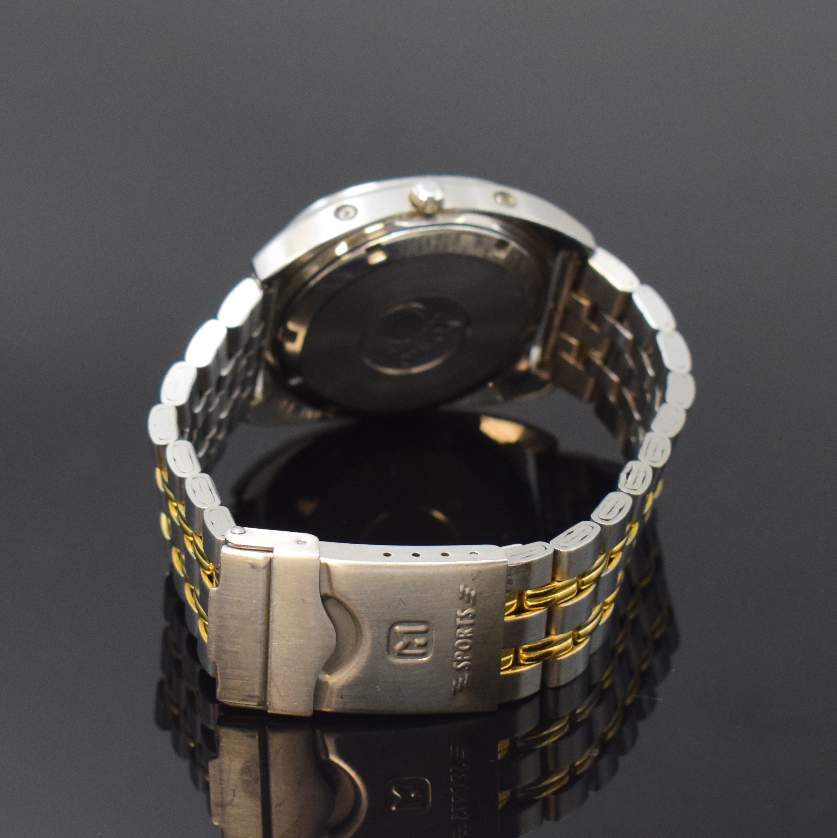 Detail b: OMEGA Megaquarz 32KHz Herrenarmbanduhr in Stahl Referenz 196.008, Schweiz um 1974, quarz, neutr. Gliederband m. Faltschl., Boden verschr., ...