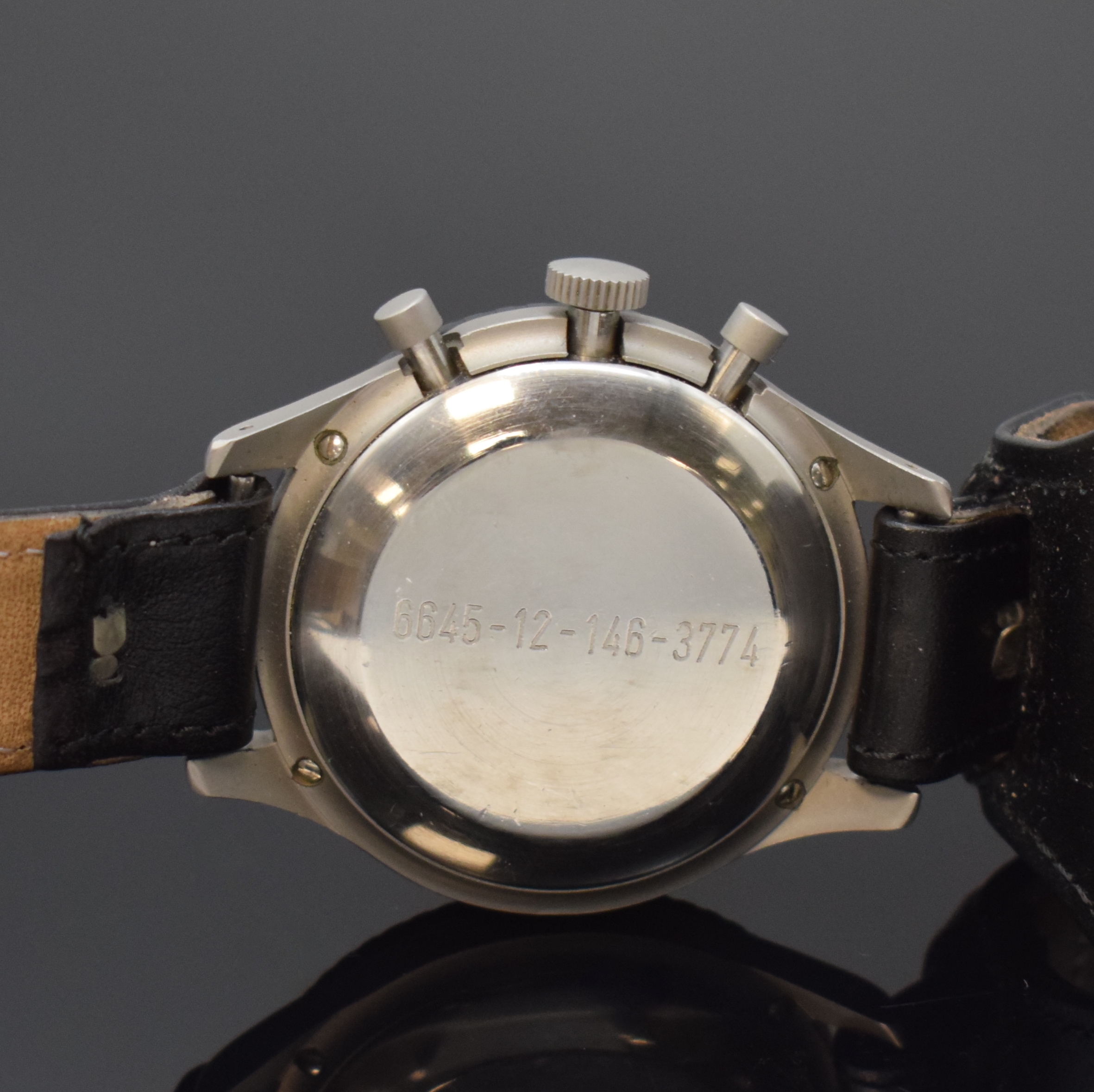 Detail c: HEUER 3H Flieger-Schaltradchronograph, Schweiz um 1970, Handaufzug, mattiertes Geh. 4-fach verschr., Boden m. Versorgungsnummer 6645-12-146-3774, ...