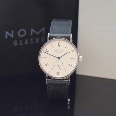 Image 26785249 - NOMOS Glashütte gents wristwatch Tangomat in steel reference 602, self winding, on both sides glazed case including original leather strap with original buckle, case back 6-times screwed, silvered dial, display of hours, minutes and constant second, date, fausses cotes decoration, 26 jewels, calibre Epsilon, diameter approx. 38 mm, original box and papers, sold in April 2008, condition 2, property of a collector