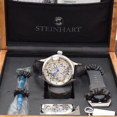 26785298e - STEINHART rare, to 20 pieces limited gents wristwatch ESQUELETO, manual winding, on both sides glazed stainless steel case including leather strap with original deployant clasp, screwed down case back, full skeletonized glazed movement, blued steel hands, display of hours, minutes and constant second, base calibre Unitas 6498, diameter approx. 47 mm, original box, additional bracelet with buckle, changing tool and papers, sold in August 2008, condition 2, property of a collector