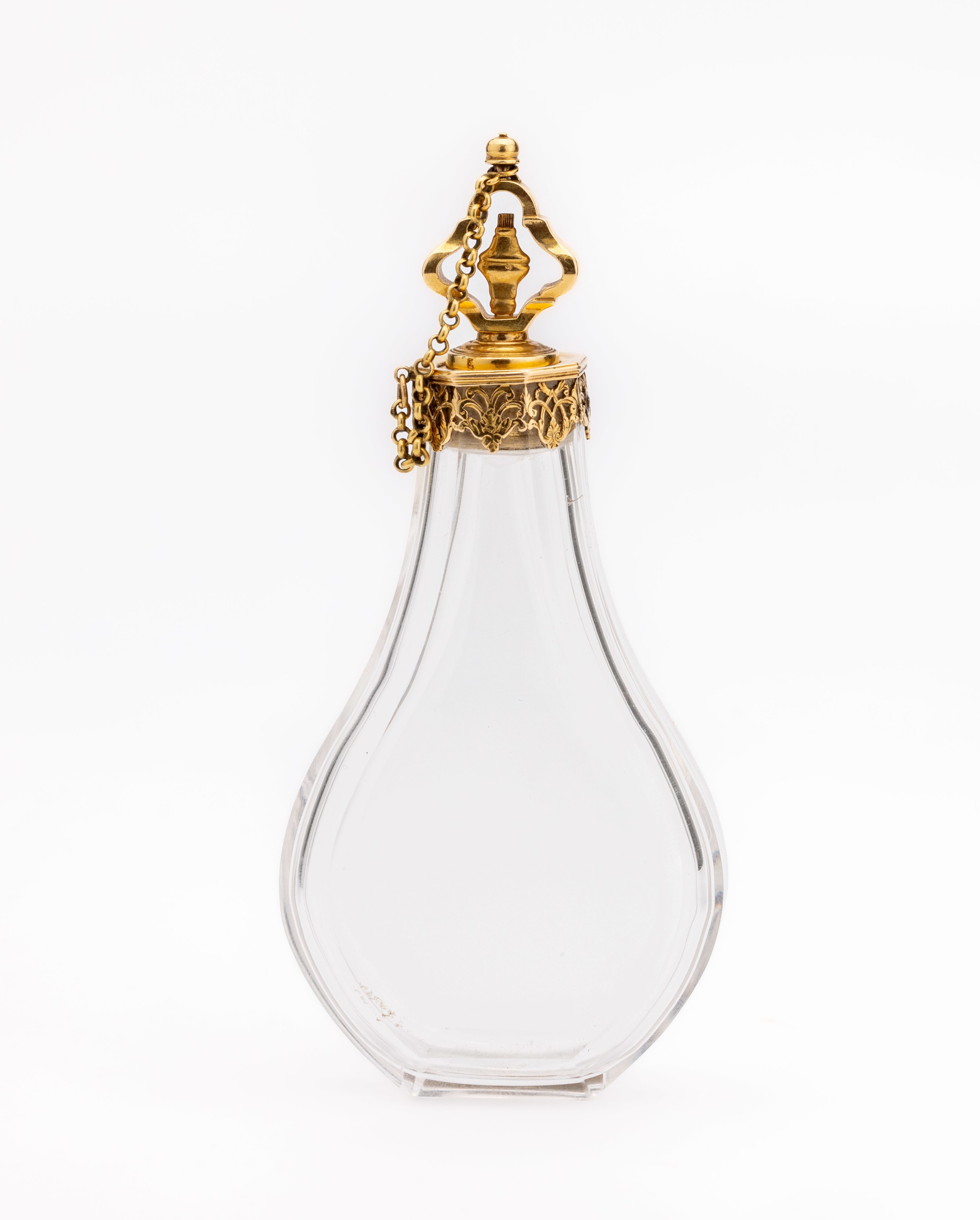 Parfümflakon mit 18 kt Gold Montur, GG 750/000, um 1910, Kristallglas geschliffen, birnenförm., Montur mit Girlandendekor, gesägt, ca. 12 cm