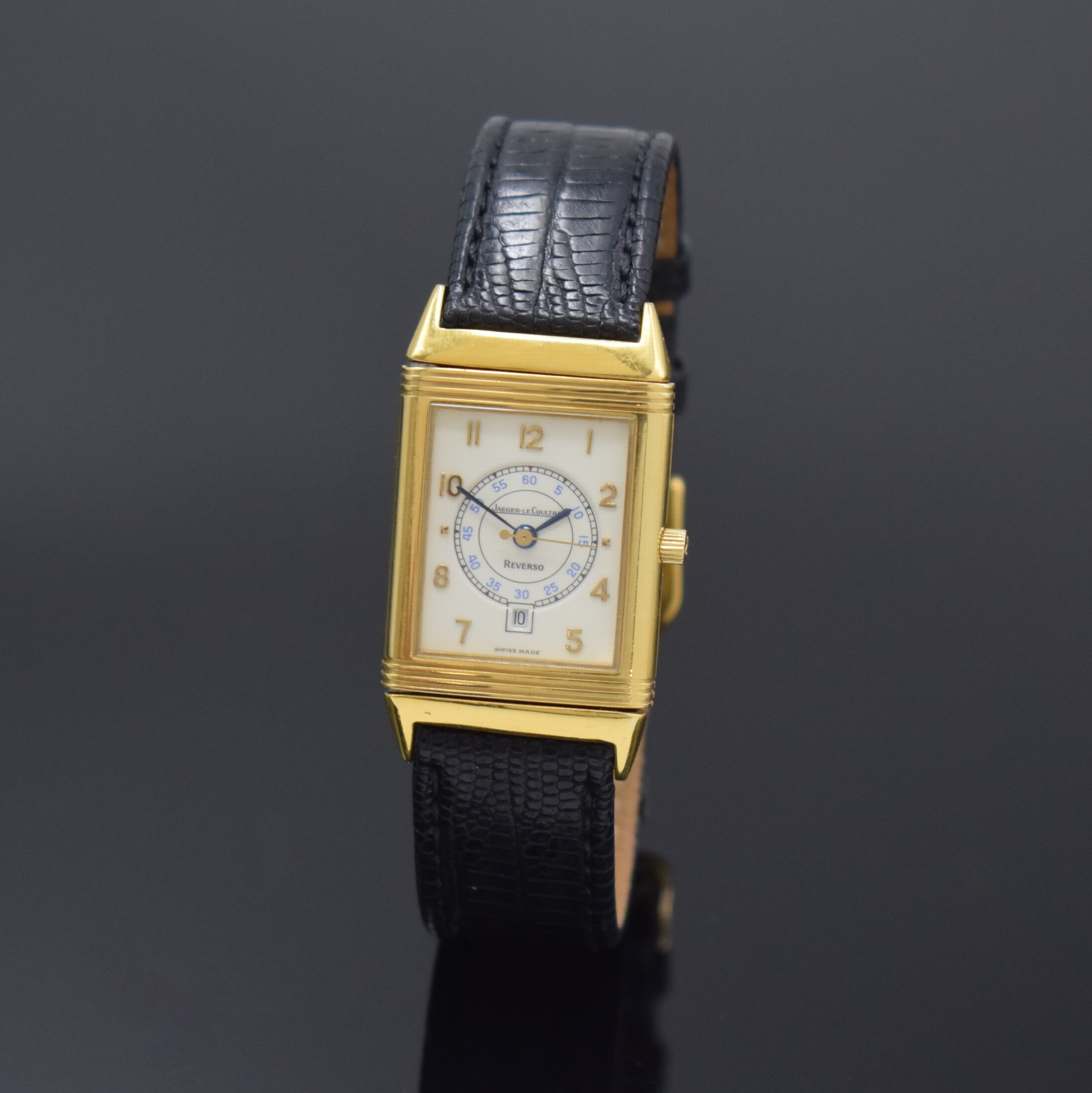 Jaeger-LeCoultre Reverso Armbanduhr in GG 750/000, Schweiz um 1995, quarz, um 180 Grad drehb. Wendegeh., seitl. verschr., cremefarb. Zifferbl. m. ...