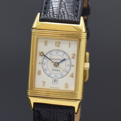 26786819a - Jaeger-LeCoultre Reverso 18k yellow gold wristwatch, Switzerland around 1995, quartz, around 180 degree revolving reverse case, at the sides screwed down, cream colored dial with Arabic numerals, blued steel hands, date at 6, measures approx. 40 x 23 mm, case number as well as reference number not visible anymore, signs of use, condition 2-3