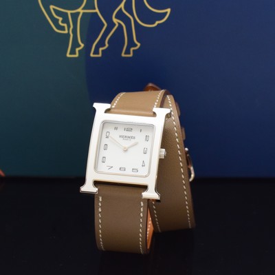 Image HERMES wristwatch series Heure H reference HH1.830, stainless steel case including original leather strap with original buckle, quartz, case back screwed-down 4-times, white dial with Arabic hour, display of hour & minutes, measures approx. 36 x 30 mm, Hermes storage back enclosed, unworn stock, condition 1-2