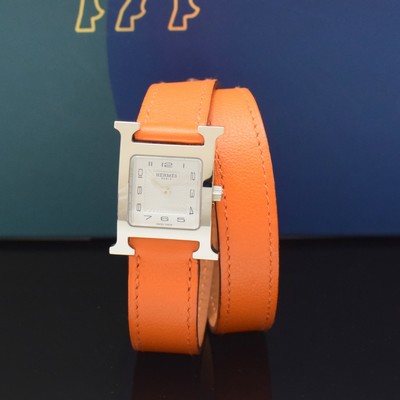 Image HERMES ladies wristwatch series Heure H reference HH1.210, stainless steel case including original leather strap with original buckle, quartz, case back screwed- down 4-times, white dial with Arabic hour, display of hour & minutes, measures approx. 30 x 25 mm, Hermes storage back enclosed, unworn stock, condition 1-2