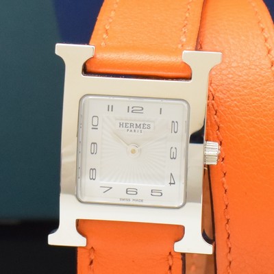 26787158a - HERMES ladies wristwatch series Heure H reference HH1.210, stainless steel case including original leather strap with original buckle, quartz, case back screwed- down 4-times, white dial with Arabic hour, display of hour & minutes, measures approx. 30 x 25 mm, Hermes storage back enclosed, unworn stock, condition 1-2