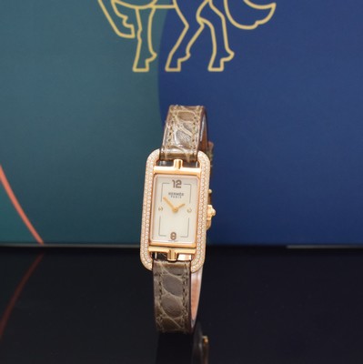 Image HERMES ladies wristwatch series Nantucket reference NA2.171, 18k pink gold including original leather strap with original 18k pink gold buckle, quartz, case back screwed-down 4 -times, case at the sides with diamonds, mother of pearl dial, display of hour & minutes, measures approx. 33 x 17 mm, Hermes storage back enclosed, unworn stock, condition 1-2