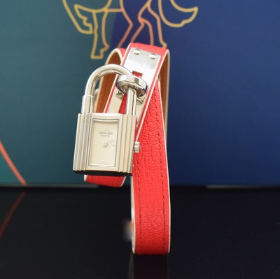 Image HERMES Kelly ladies wristwatch reference KE1.210, quartz, stainless steel case including original leather strap with original buckle, case lateral 4-times screwed down, silvered dial, silvered hands, measures approx. 39 x 20 mm, Hermes storage back enclosed, unworn stock, condition 1-2