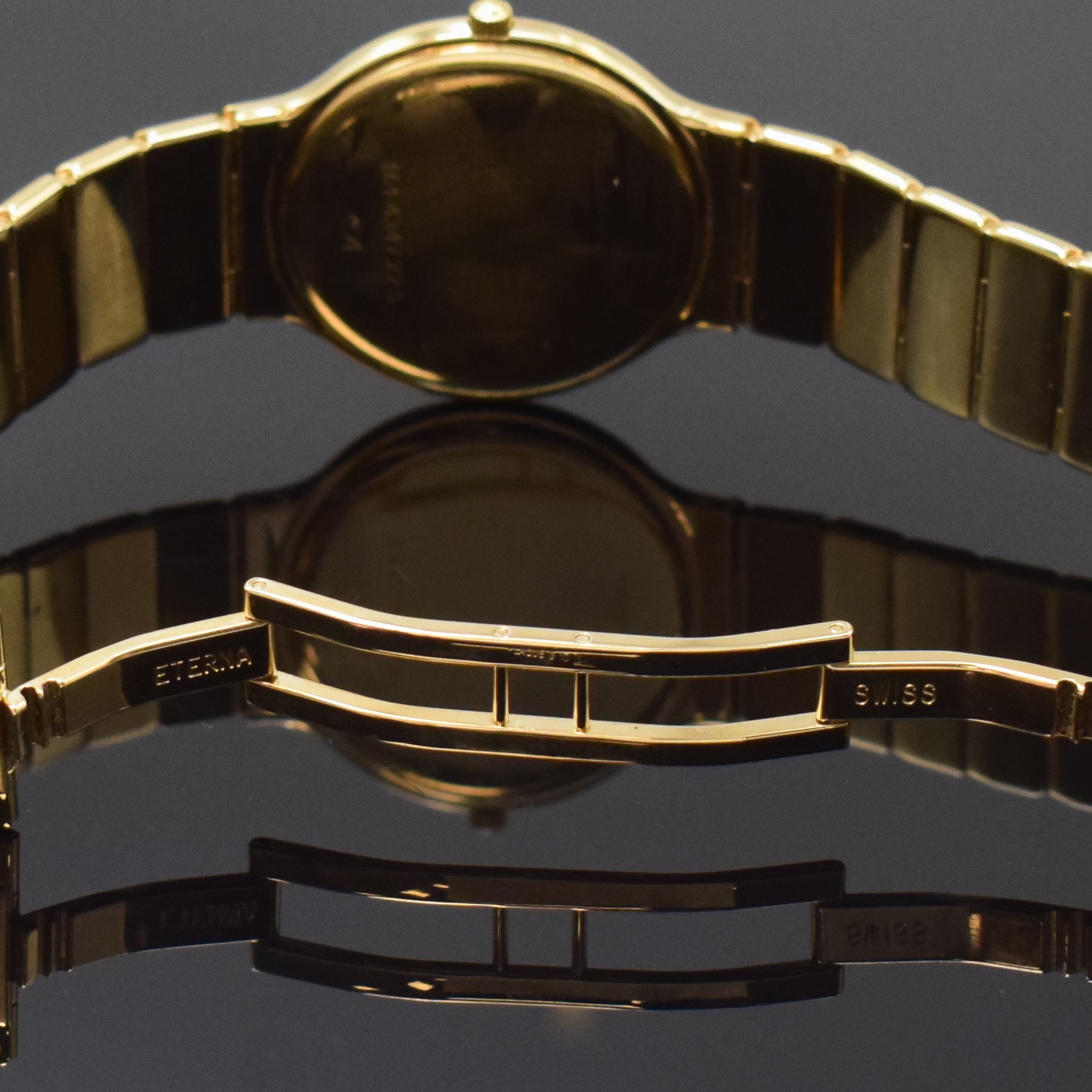 Detail b: ETERNA vergoldete Armbanduhr, Schweiz um 1990, quarz, Geh. an verg. orig. Band m. dopp. Faltschl., Boden aufgedr., goldfarb. Strukturzifferbl. m. ...