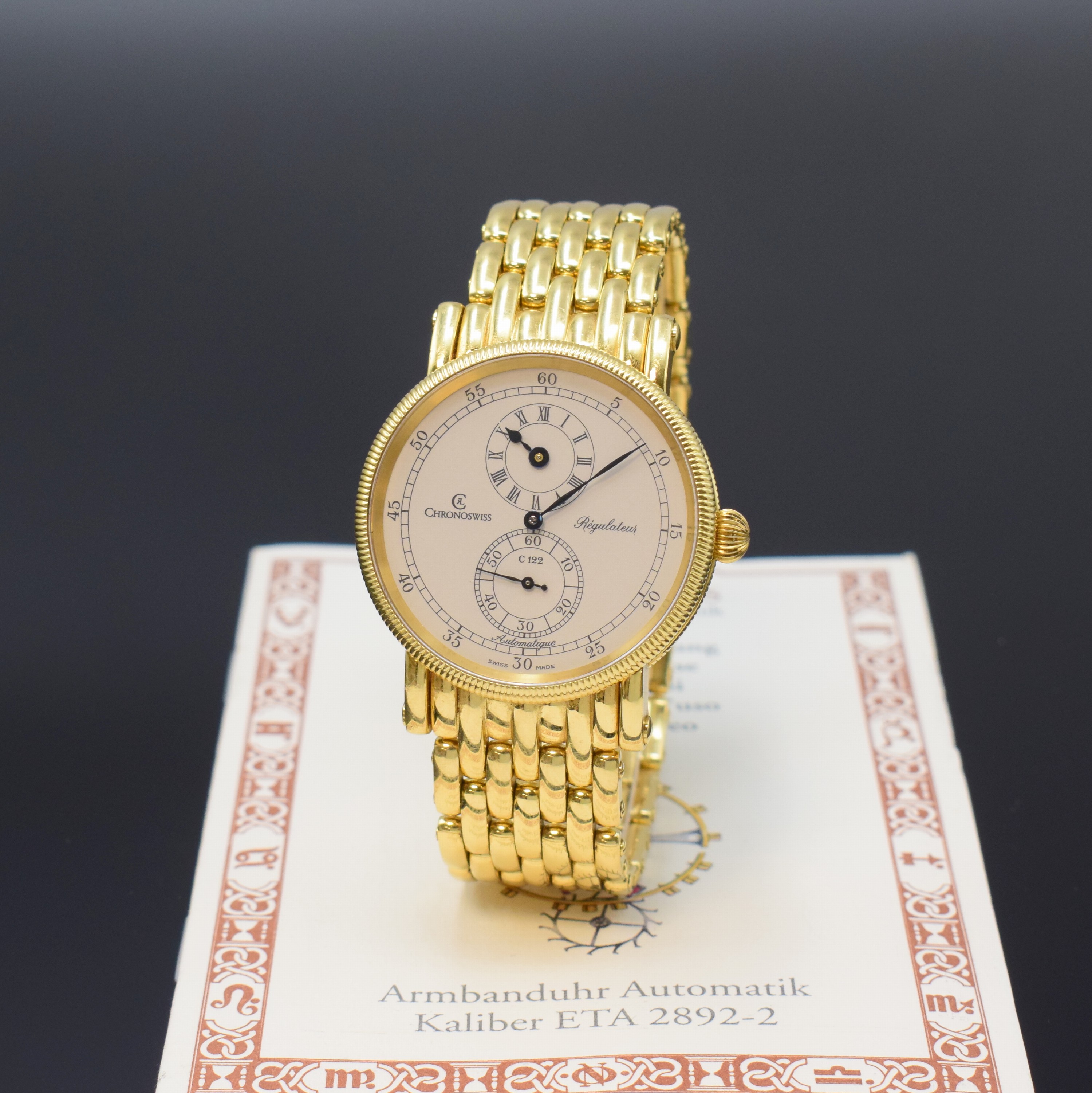 CHRONOSWISS Herrenarmbanduhr Regulateur in GG 750/000 Referenz CH 1221, Schweiz um 2000, Automatik, beids. vergl. Geh. inkl. orig. Goldband m. dopp. ...