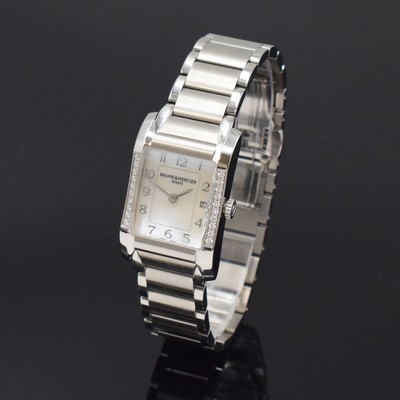 26787938b - BAUME & MERCIER ladies wristwatch series Hampton reference 65725, quartz, stainless steel case including bracelet with butterfly buckle, bezel at the sides diamonds set, mother of pearl dial with raised Arabic hours, display of hours, minutes & date, measures approx. 34 x 22 mm, length approx. 18,5 cm, condition 2