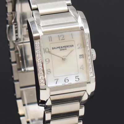 26787938e - BAUME & MERCIER ladies wristwatch series Hampton reference 65725, quartz, stainless steel case including bracelet with butterfly buckle, bezel at the sides diamonds set, mother of pearl dial with raised Arabic hours, display of hours, minutes & date, measures approx. 34 x 22 mm, length approx. 18,5 cm, condition 2