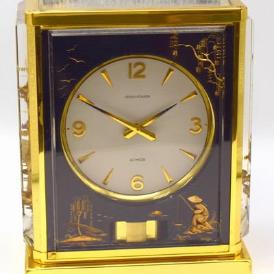 26787944a - Jaeger-LeCoultre table clock series Atmos Marina, Switzerland around 1980, lavish case, Messingaußenteile gold plated, front and both sides with representation Chinese scene, gold-plated movement with torsion-pendulum, wound by barometric pressure changes, chain and barrel, Aneroid-cell, (Perpetuum-Mobile), measures approx. 23 x 18 x 14 cm, condition 2 -3