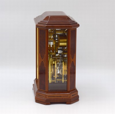 26787973b - ERWIN SATTLER rare, to 200 pieces limited table clock with perpetual calendar model 1294, Germany around 2000, key winding, specification from the year 1903, precious wood housing with gold-plated brass columns, bevelled glass, silvered dial with Arabic numerals, blue hands, gold-plated 8-days watch mechanism with 11 jewels calibre 1200, separate calendar work with 1 year duration of run, measures approx. 23 x 16,5 x 11,5 cm, original box, key, description and Certificate of origin enclosed, condition 2