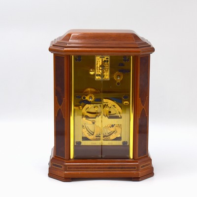 26787973c - ERWIN SATTLER rare, to 200 pieces limited table clock with perpetual calendar model 1294, Germany around 2000, key winding, specification from the year 1903, precious wood housing with gold-plated brass columns, bevelled glass, silvered dial with Arabic numerals, blue hands, gold-plated 8-days watch mechanism with 11 jewels calibre 1200, separate calendar work with 1 year duration of run, measures approx. 23 x 16,5 x 11,5 cm, original box, key, description and Certificate of origin enclosed, condition 2