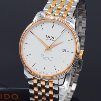 26788285a - MIDO Baroncelli Heritage nearly mint gents wristwatch reference M027407A, self winding, partial PVD-coated stainless steel case including original bracelet with butterfly buckle, on both sides glazed, case back screwed-down 4-times, silvered structure-dial with dash indices, gilded hands, date at 3, diameter approx. 39 mm, length approx. 22 cm, condition 1-2