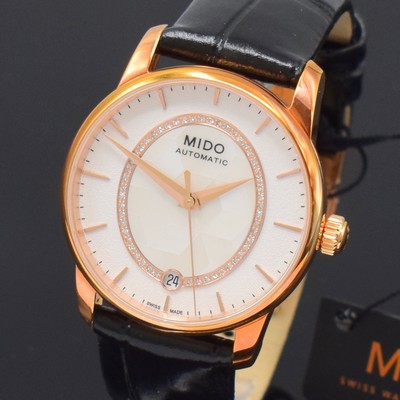 26788580a - MIDO Baroncelli nearly mint wristwatch reference M007207A, self winding, gold-plated stainless steel case including original leather strap with butterfly buckle, on both sides glazed, snap on case back, silvered dial with gilded hour-indices, in the middle mother of pearl and diamonds, date at 6, diameter approx. 33 mm, condition 1-2