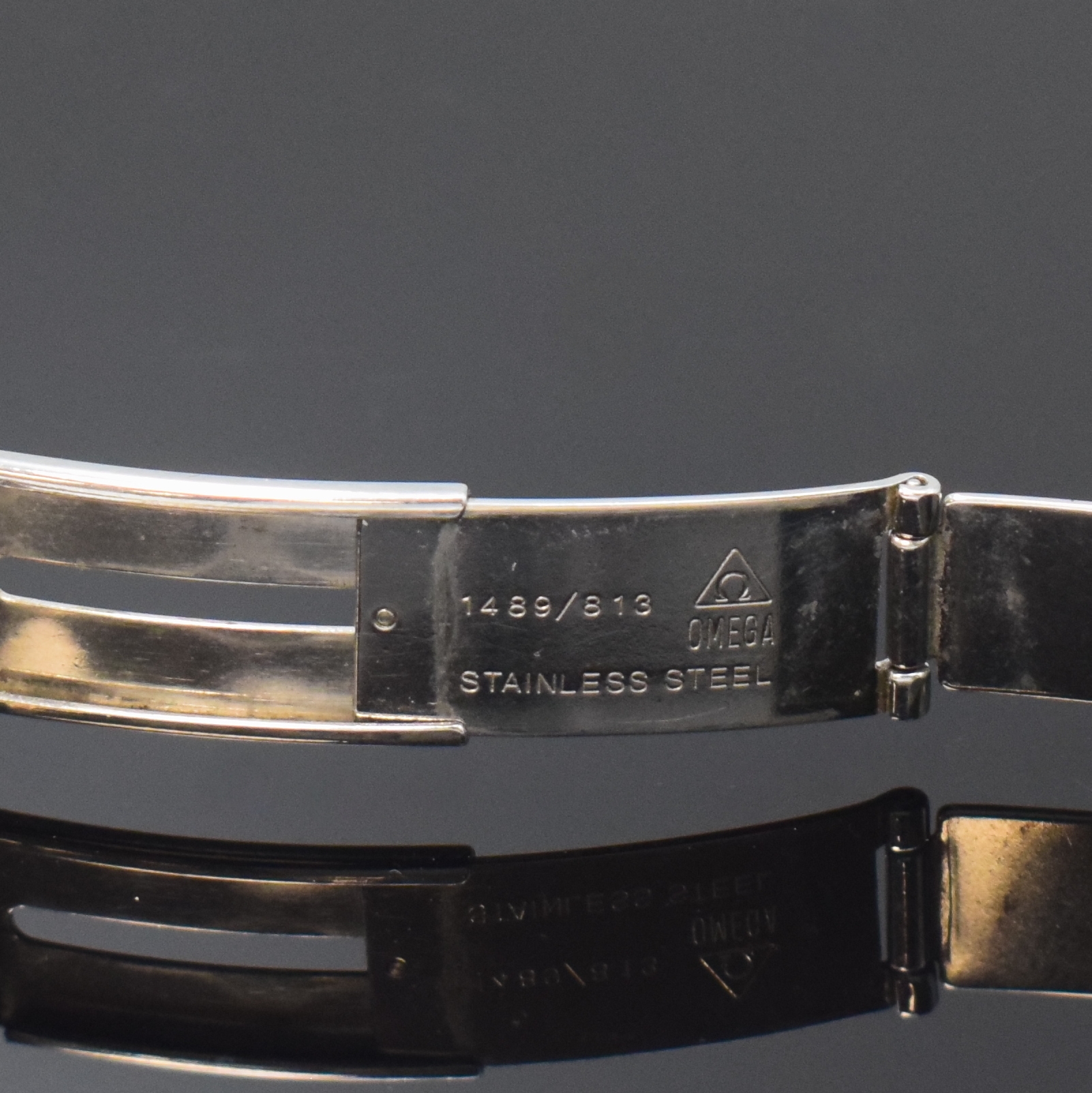 Detail c: OMEGA Gliederband in Stahl/Gold Referenz 1489/813, Faltschl., L. ca. 16,5 cm, Anstöße ca. 18 mm, Nutzsp., in gebrauchsfähigem Zustand