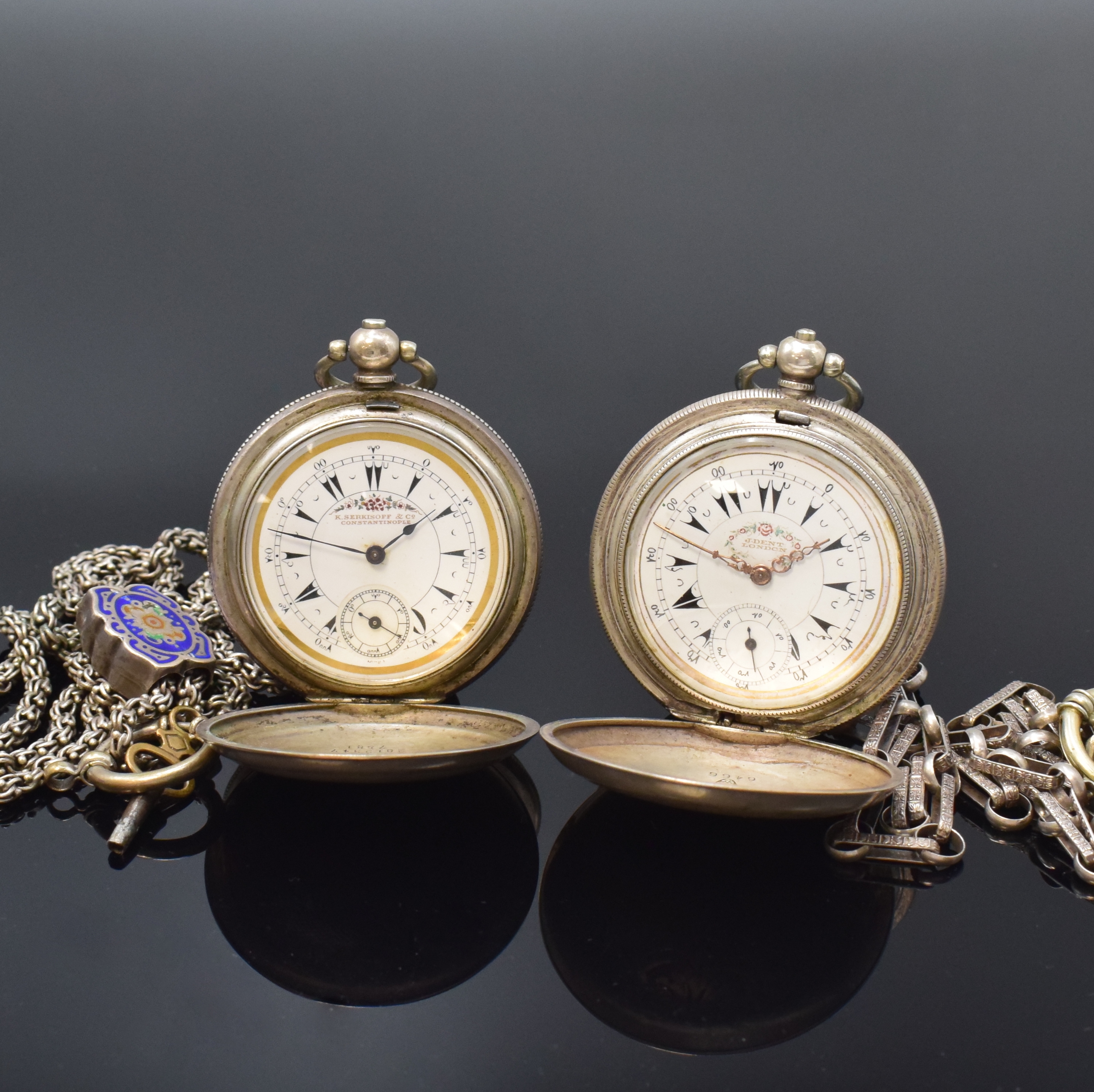 Konvolut: 2 Taschenuhren für den osmanischen Markt in Silber an Ketten, um 1880, Schlüsselaufzug, guill. Geh. ber./dell., Emailzifferblätter m. ...
