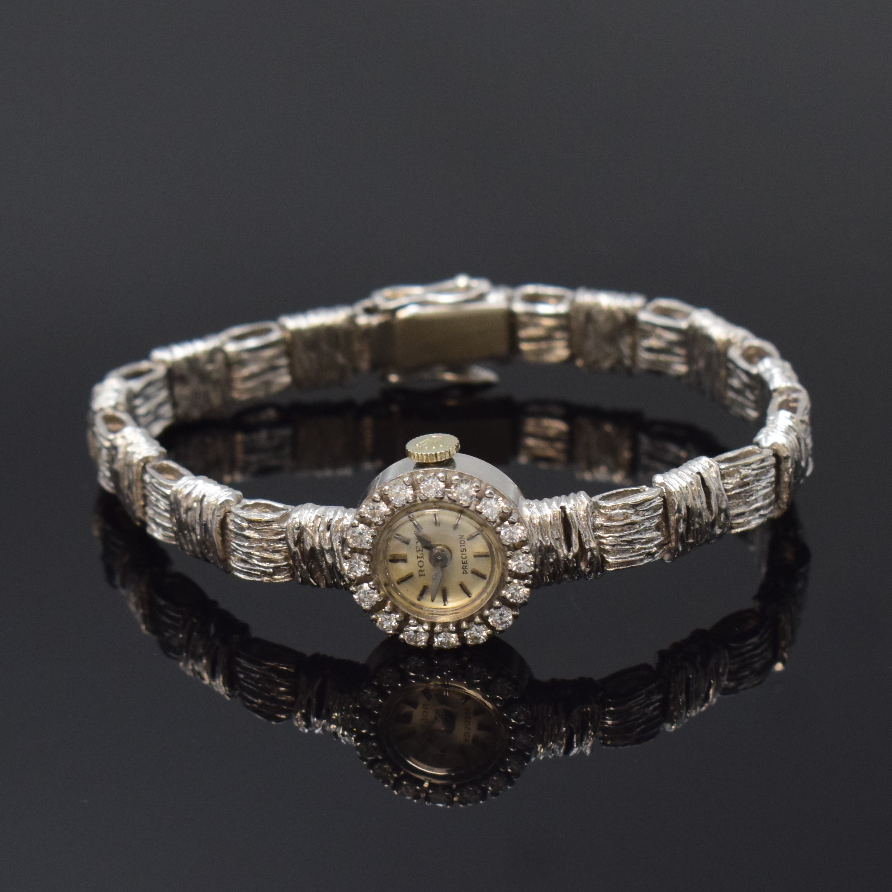 ROLEX Precision Damenarmbanduhr in WG 750/000 mit Diamanten, Schweiz um 1970, Handaufzug, rhod. Geh. an orig. Goldband, Boden aufgedr., Lünette ...