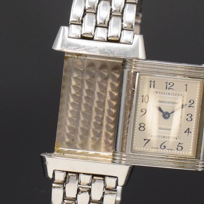 26790793b - Jaeger-LeCoultre Reverso Duetto ladies wristwatch reference 266.8.44, Switzerland around 2000, manual winding, stainless steel- reverse case, original bracelet with butterfly buckle, one page engine-turned dial in the middle with mother of pearl and outside diamonds, gilded hands, other side silvered, Arabic numerals, blued steel hands, in center engine-turned, measures approx. 33 x 21 mm, length approx. 19,5 cm, JL box enclosed, signs of use otherwise condition 2