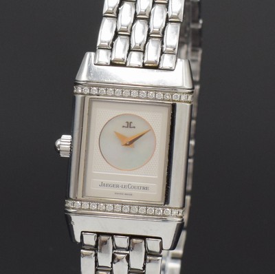 26790793c - Jaeger-LeCoultre Reverso Duetto ladies wristwatch reference 266.8.44, Switzerland around 2000, manual winding, stainless steel- reverse case, original bracelet with butterfly buckle, one page engine-turned dial in the middle with mother of pearl and outside diamonds, gilded hands, other side silvered, Arabic numerals, blued steel hands, in center engine-turned, measures approx. 33 x 21 mm, length approx. 19,5 cm, JL box enclosed, signs of use otherwise condition 2