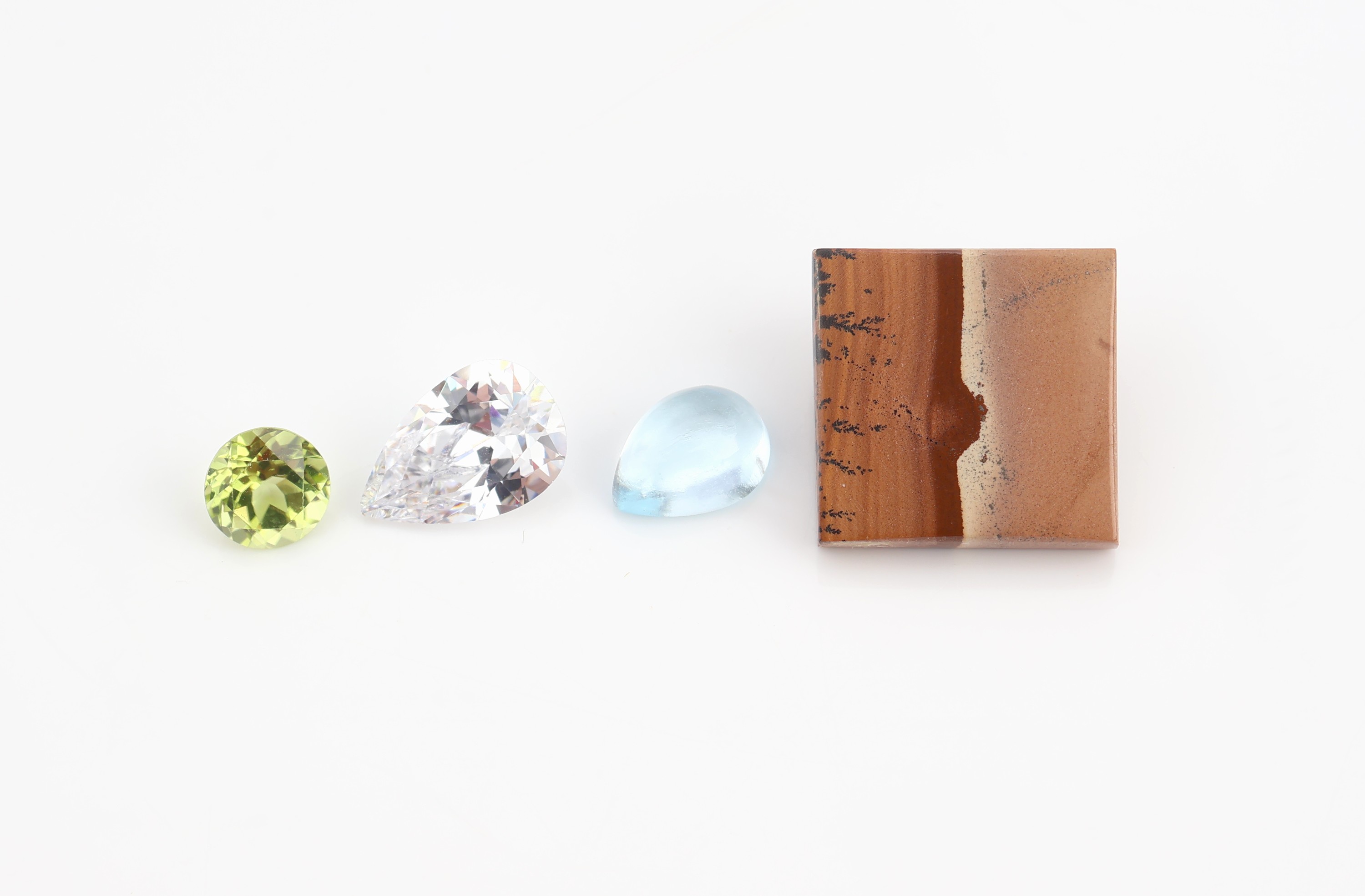 Detail a: Konvolut lose Farbsteine, best. aus: 9 Landschaftsachaten in versch. Formen zus. ca. 2.05 ct, 2 tropfenförm. Zirkone ca. 3.85 ct, 3 rundfacett. ...