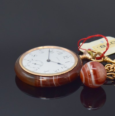 26790946b - ZENITH open face pocket watch in agate-case with 14k gold chain including agate-ball, Switzerland around 1920, monocoque case with screwed down gold-plated bezel, enamel dial with Arabic numerals, constant second at 6, blued spade hands, silvered movement with decoration polishing, 15 jewels, compensation-balance with Breguet-hairspring, precision adjustment, diameter approx. 52 mm, length approx. 29 cm, overhaul recommended at buyer's expense, condition 2-3, property of a collector