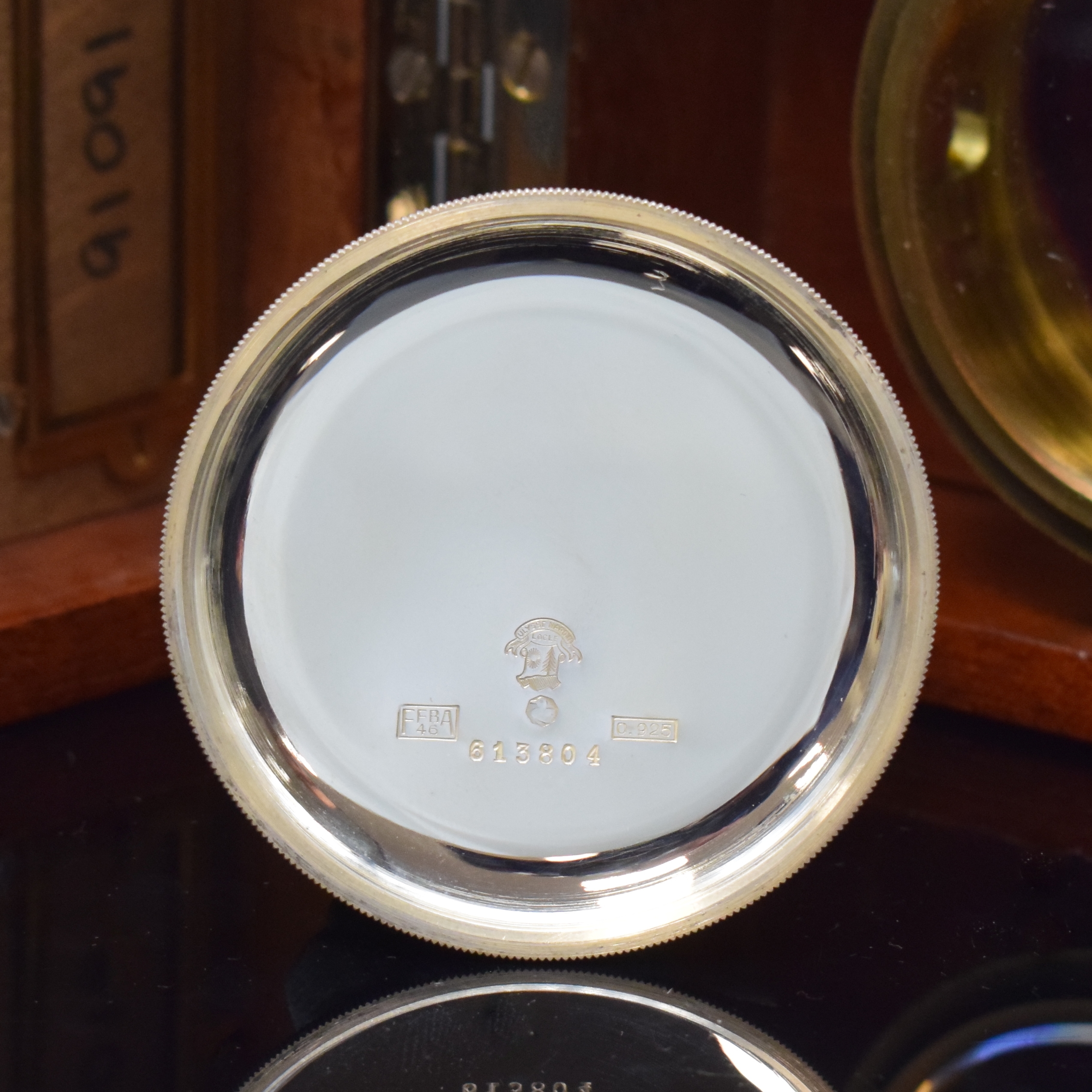 Detail e: ULYSSE NARDIN Beobachtungsuhr der britischen Marine in Silber, Schweiz um 1940, verschr. Sterlingsilbergeh., Boden m. Militärgravur, Lunette ohne ...