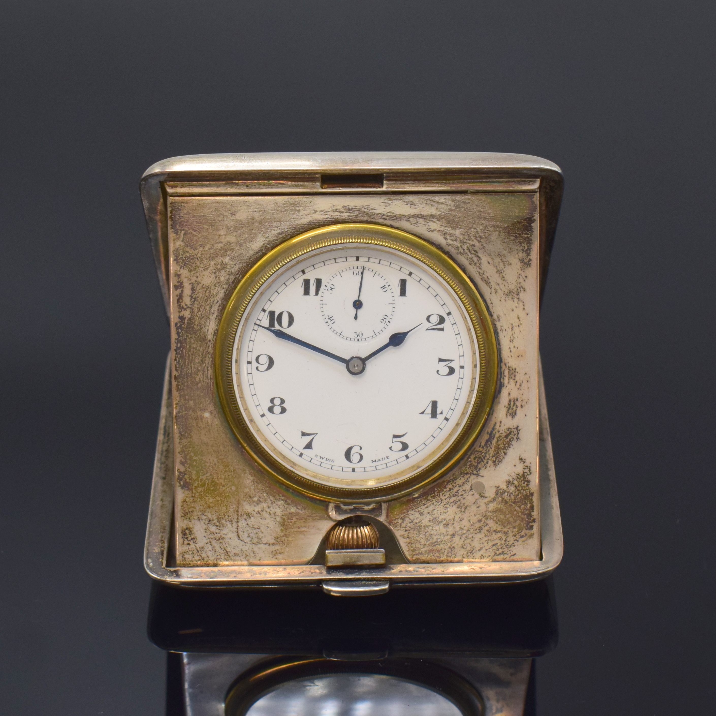DOXA Reiseuhr im Sterlingsilber-Gehäuse, London lt. Hallmark 1921, Handaufzug, aufklappbares Geh. dell., Scharnierboden, Emailzifferbl. m. arab. ...