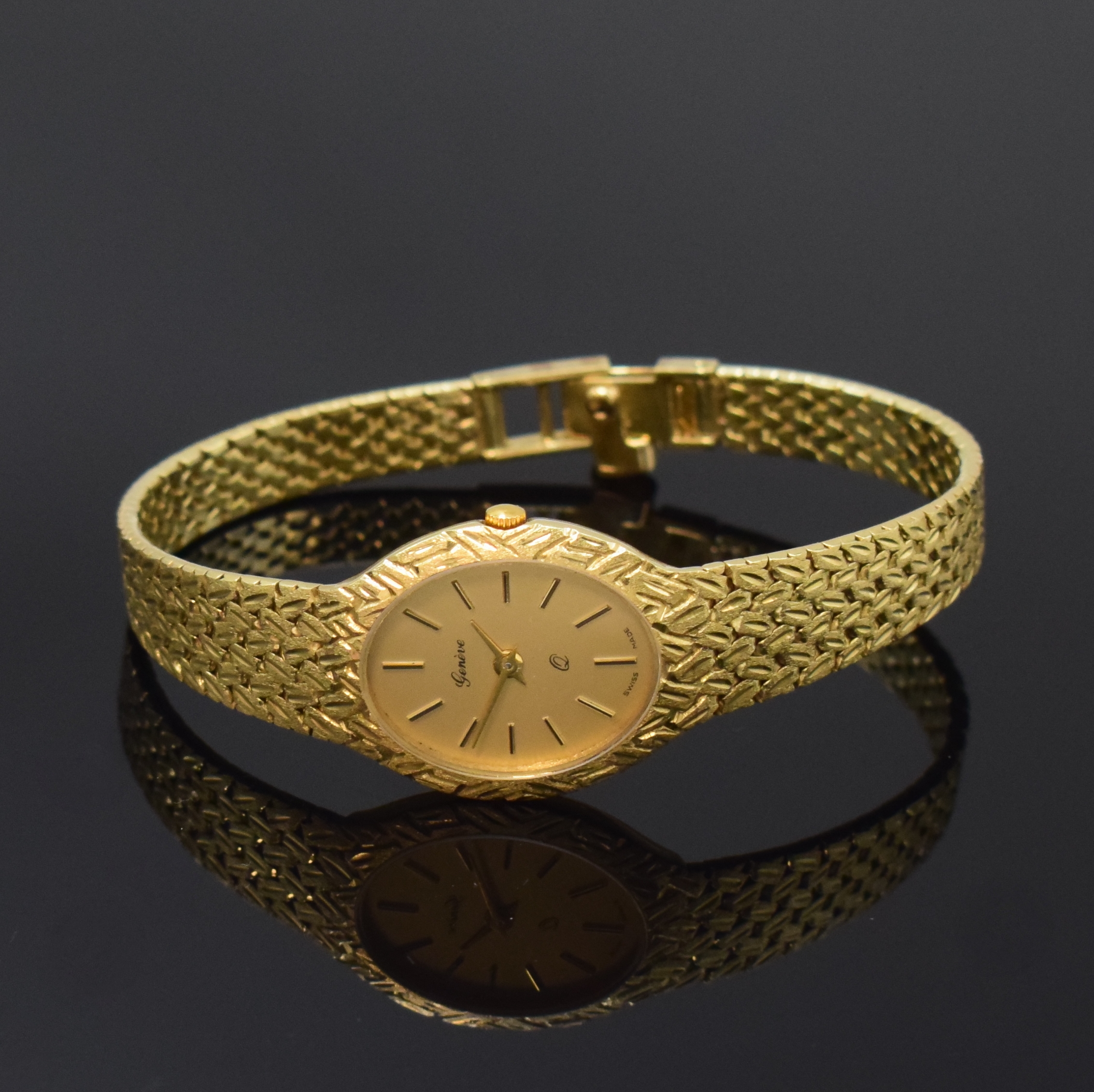 GENEVE Damenarmbanduhr in GG 585/000, Schweiz um 1980, quarz, Boden aufgedr., Design von Lünette in Band übergehend, gold. Zifferbl. m. aufgel. ...