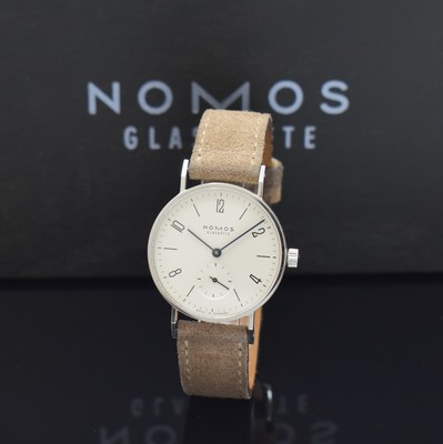 Image 26791714 - NOMOS wristwatch Tangente, Germany around 2006, manual winding, stainless steel case including original leather strap with original buckle, snap on case back, silvered dial, blued steel hands, 17 jewels, calibre Alpha, blued screws, fausses cotes decoration, diameter approx. 33 mm, original box, condition 2