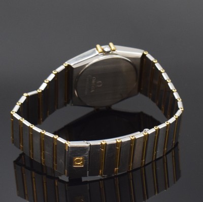 26792111b - OMEGA gents wristwatch Constellation reference 396.1070/396.1080, Switzerland around 1990, stainless steel/gold combined including bracelet, snap on case back, gold bezel with black, Roman indices, gilded dial, quartz, display of hours, minutes, sweep seconds and date, diameter approx. 33 mm, length approx. 19 cm, Omega box, condition 2-3