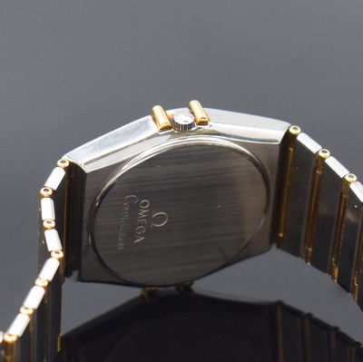 26792111d - OMEGA gents wristwatch Constellation reference 396.1070/396.1080, Switzerland around 1990, stainless steel/gold combined including bracelet, snap on case back, gold bezel with black, Roman indices, gilded dial, quartz, display of hours, minutes, sweep seconds and date, diameter approx. 33 mm, length approx. 19 cm, Omega box, condition 2-3