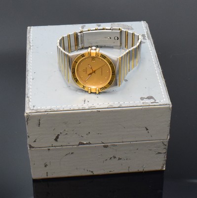 26792111e - OMEGA gents wristwatch Constellation reference 396.1070/396.1080, Switzerland around 1990, stainless steel/gold combined including bracelet, snap on case back, gold bezel with black, Roman indices, gilded dial, quartz, display of hours, minutes, sweep seconds and date, diameter approx. 33 mm, length approx. 19 cm, Omega box, condition 2-3