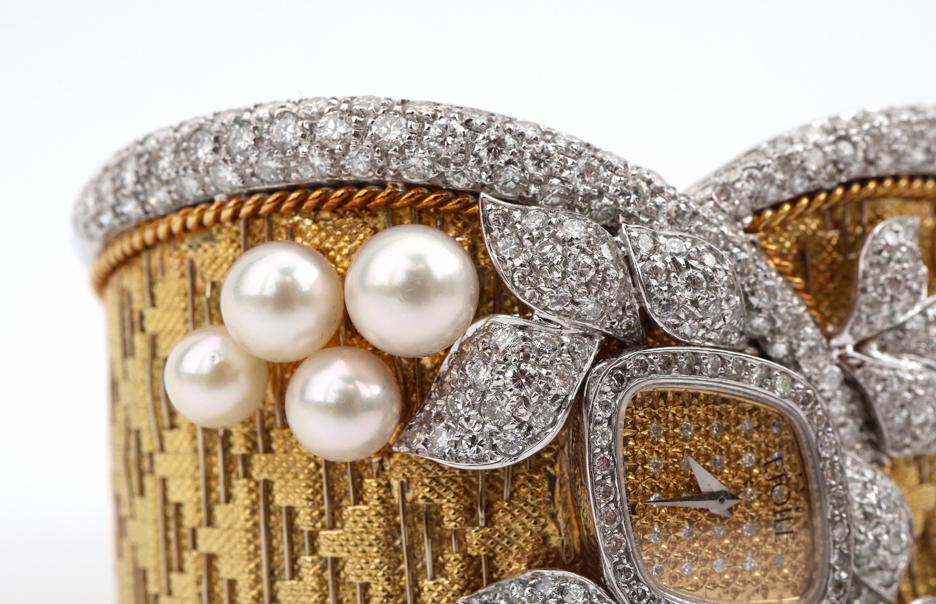 Detail d: Außergewöhnliche 18 kt Gold Perl-Brillant- Armspange mit eingebauter Uhr, GG/WG 750/000, 8 Zuchtperlen mit feinem Lüster in versch. Größen, ...