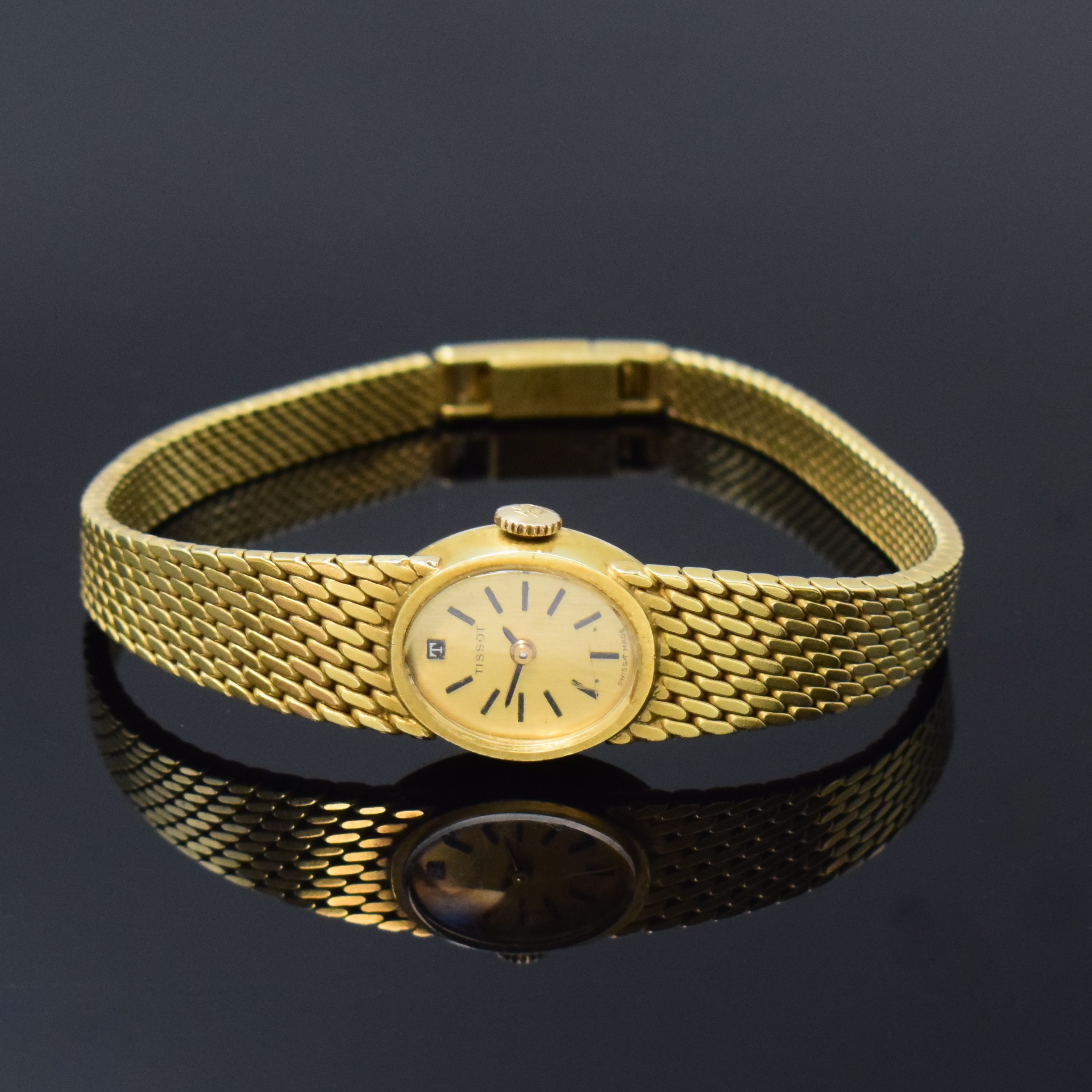 TISSOT Damenarmbanduhr in GG 585/000, Schweiz um 1965, Handaufzug, Boden aufgedr., goldfarb. Zifferbl. m. aufges. Std.-Ind., geschw. Zeiger, rotverg. ...