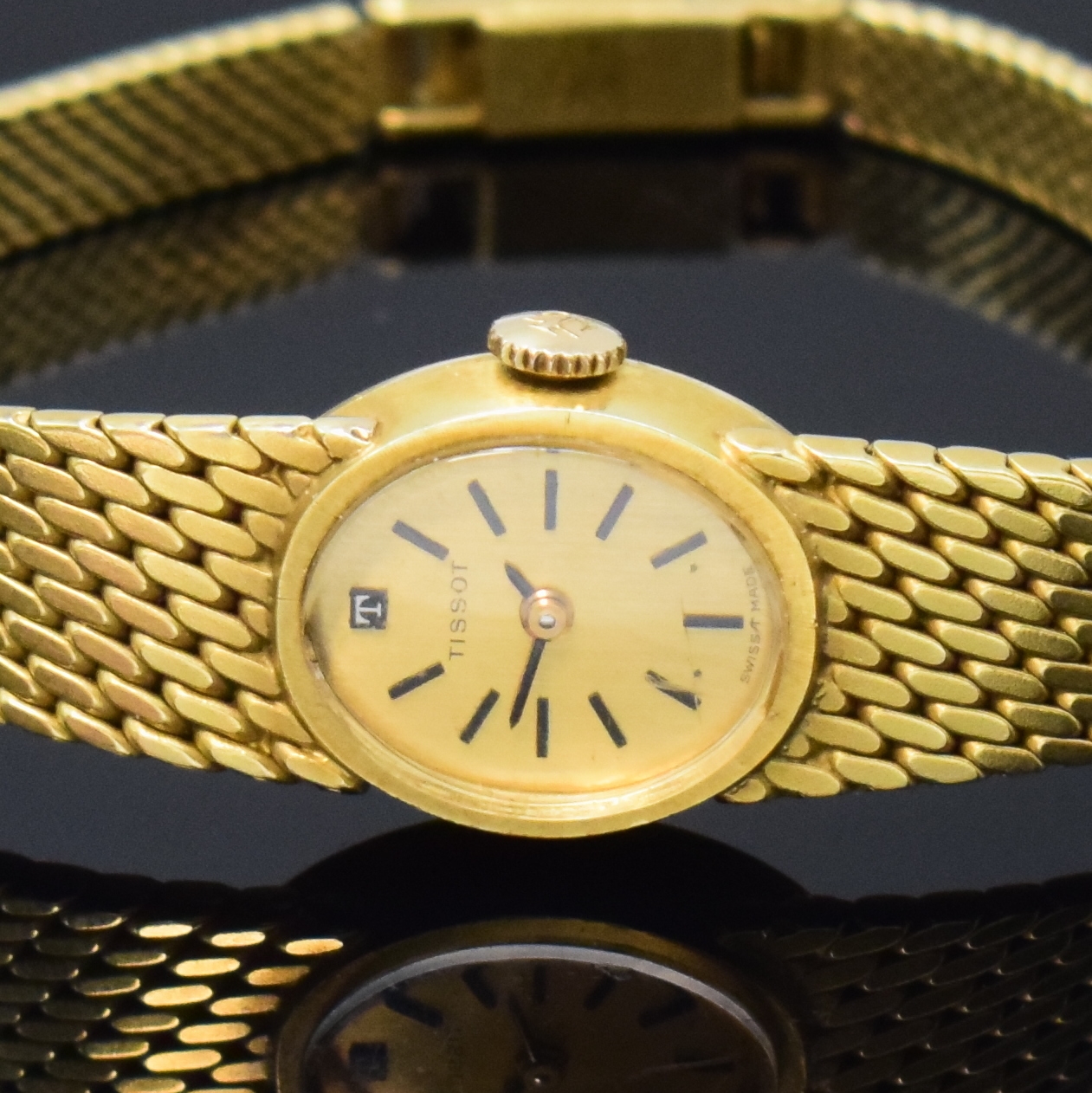 Detail a: TISSOT Damenarmbanduhr in GG 585/000, Schweiz um 1965, Handaufzug, Boden aufgedr., goldfarb. Zifferbl. m. aufges. Std.-Ind., geschw. Zeiger, rotverg. ...
