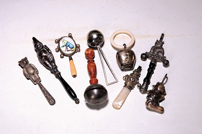 Image 26796705 - 9 rattles/baby toys, around 1900/10. partly with whistles, inter alia with enamel insert, bell with ring, clown, bear, cat etc. 3 x metal, 6 x silver