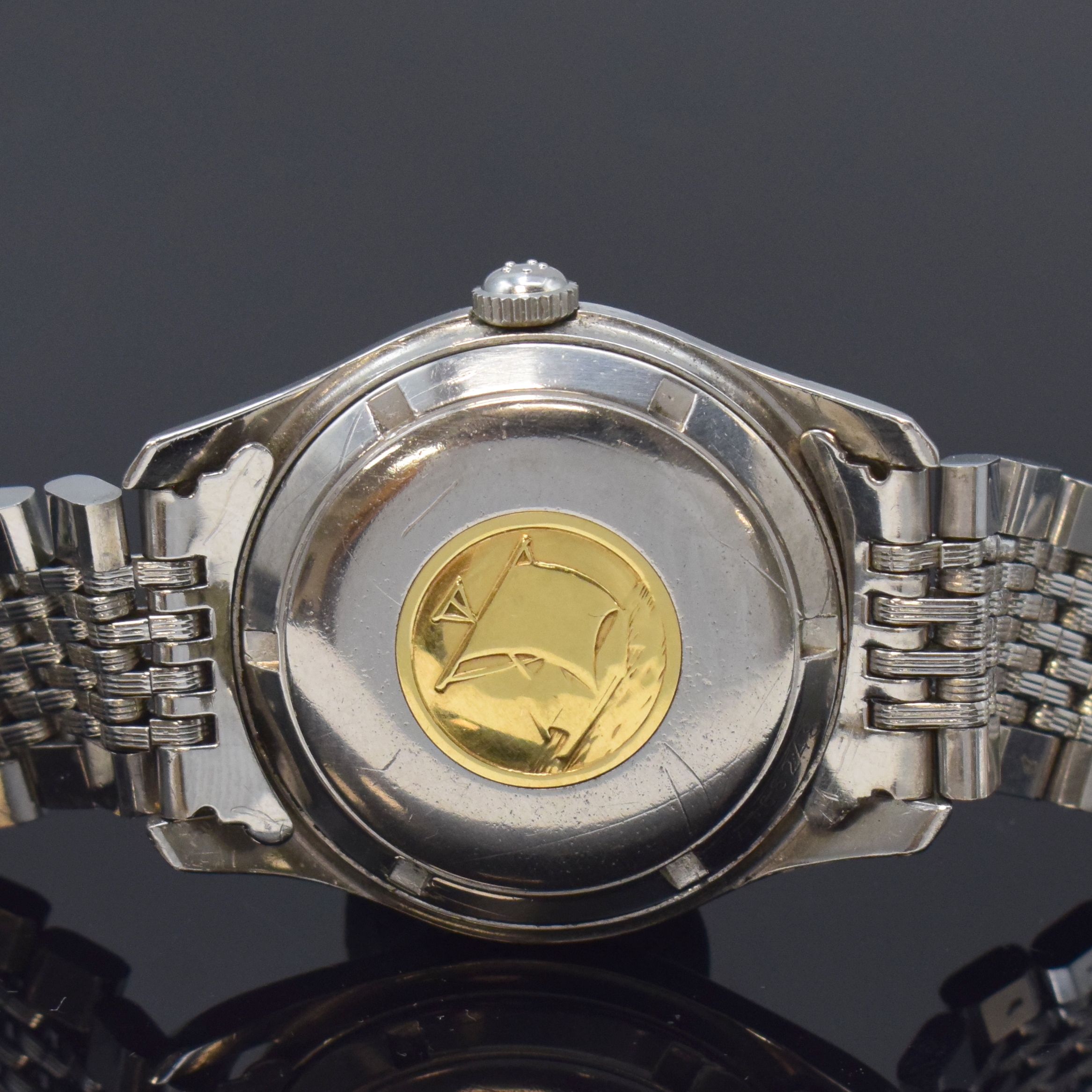 Detail d: ETERNA Kontiki Referenz 130T Herrenarmbanduhr in Stahl/Stahlband, Schweiz um 1960, Automatik, verschr. Geh., Boden m. Kontiki Gold-Plakette, orig. ...